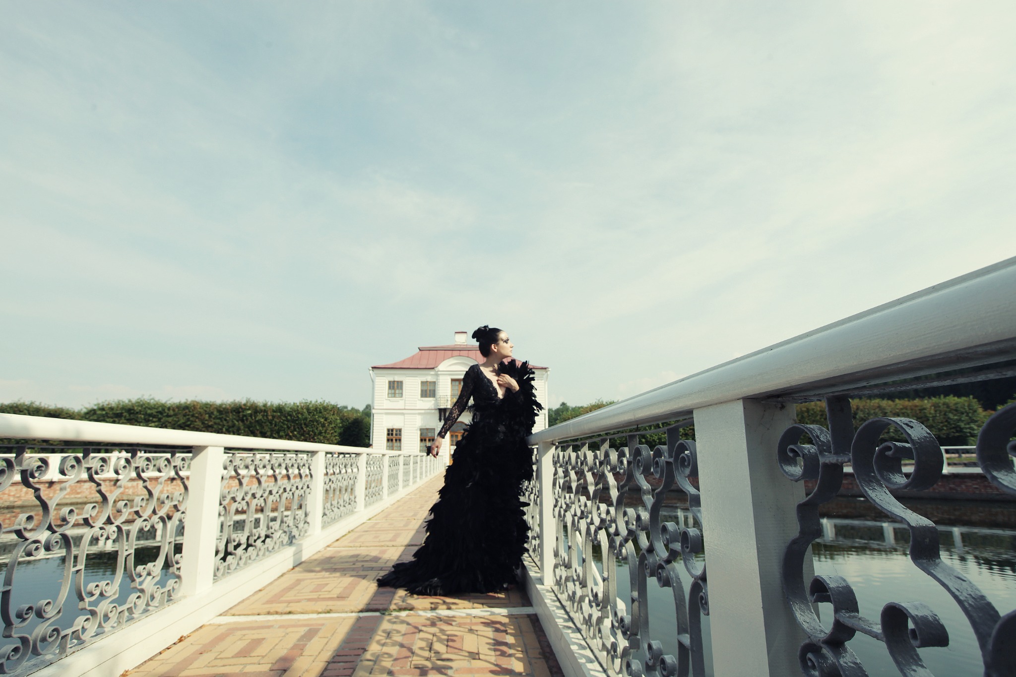 Elegant bride posing on a grand bridge
